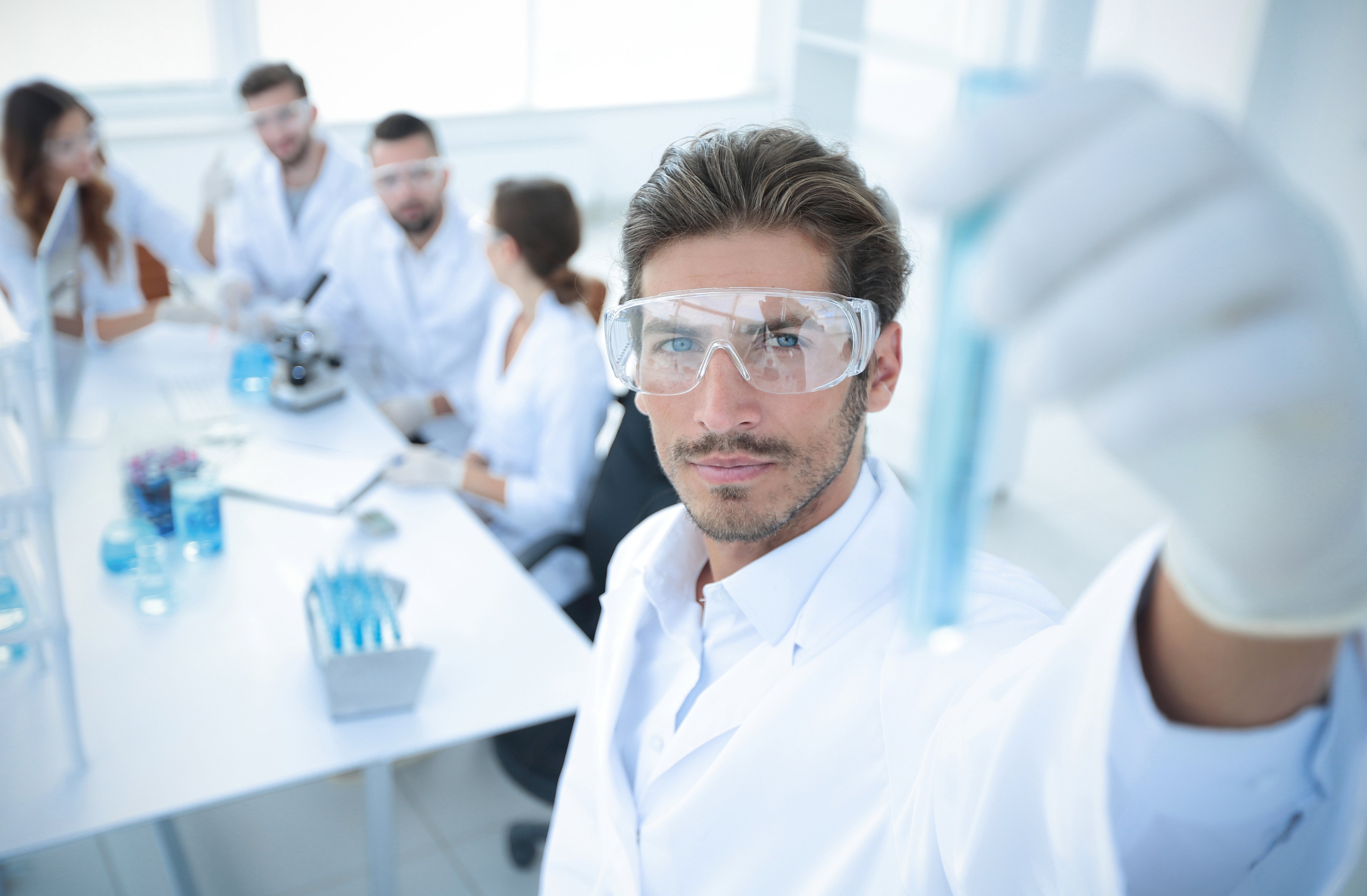 tube-with-reagents-blurred-background-laboratory